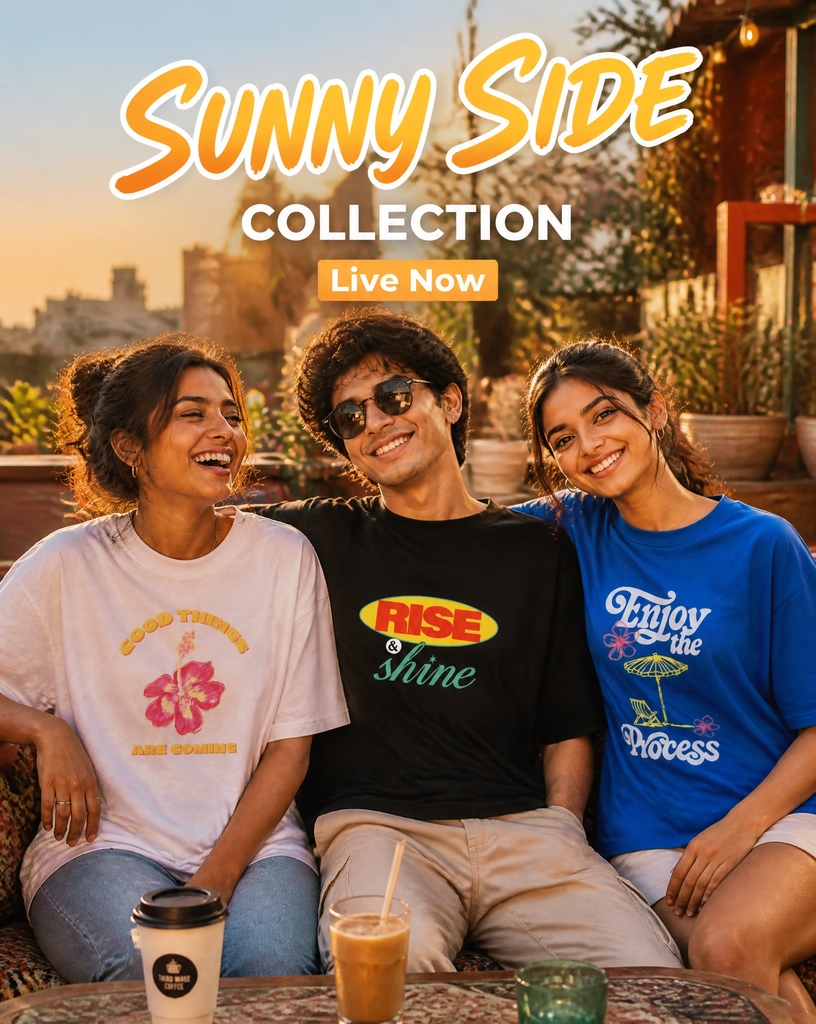 Sunny side collection - MerchGarage Blog Three friends smile as they sit outdoors at a cafe; a bold'Sunny Side Collection' banner with a 'Live Now' button is overlaid above them.